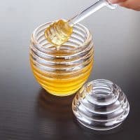 Пластиковая прозрачная банка для мёда с ложкой-палочкой