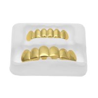 Золотые и серебряные грилзы украшения на зубы