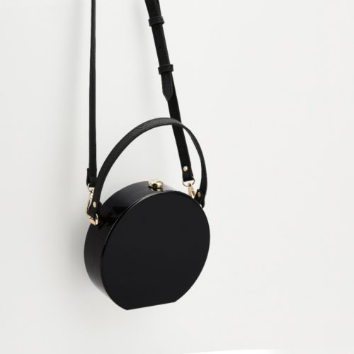 Маленькая черная круглая сумка клатч с ручкой и плечевым ремнем