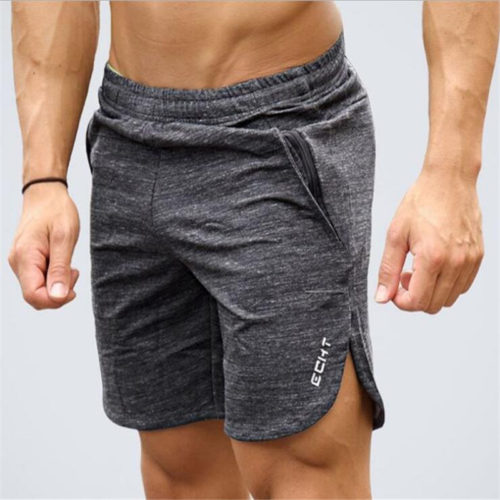 Спортивные мужские шорты на резинке с карманами и небольшими разрезами по бокам
